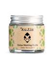 Natural detox washing grains in powder form in a glass jar with an aluminium screw top silver lid.
