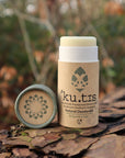 solid natural deodorant stick in a cardboard tube