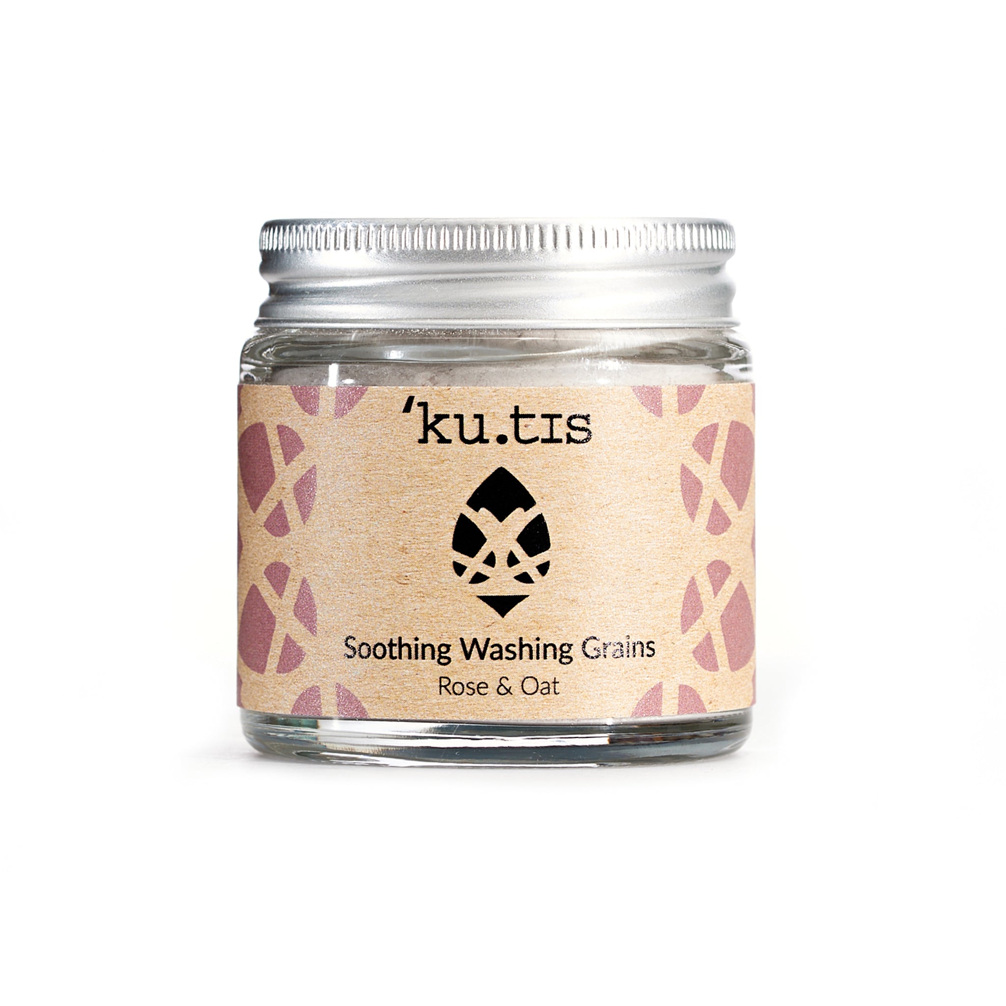 Natural soothing washing grains in powder form in a glass jar with an aluminium screw top silver lid.